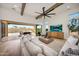 Spacious living room with high ceilings, exposed beams, and a seamless indoor-outdoor transition at 29348 N Clear Ridge Rd, Rio Verde, AZ 85263