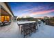 Outdoor kitchen with bar seating, built-in grill, and views of the pool and backyard at 29348 N Clear Ridge Rd, Rio Verde, AZ 85263