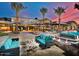 Elegant outdoor lounge area with comfortable seating, water features, and a modern building facade at 29348 N Clear Ridge Rd, Rio Verde, AZ 85263