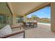 Outdoor patio area with travertine tile, a dining area, and desert landscape views at 29348 N Clear Ridge Rd, Rio Verde, AZ 85263