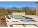 Luxurious pool and spa with an outdoor kitchen and lounge chairs at 29348 N Clear Ridge Rd, Rio Verde, AZ 85263