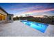 Modern swimming pool with travertine decking, lounge chairs, and desert views at 29348 N Clear Ridge Rd, Rio Verde, AZ 85263