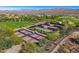 Aerial view of multiple well-maintained tennis courts surrounded by lush landscaping and community amenities at 29348 N Clear Ridge Rd, Rio Verde, AZ 85263