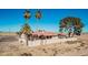 Aerial view of a single-story house, featuring a tall block wall and desert landscaping at 3279 E Selma Hwy, Casa Grande, AZ 85194