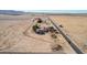 Overhead image of a rural property featuring a pool in the backyard next to open farmland at 3279 E Selma Hwy, Casa Grande, AZ 85194