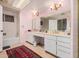 Bright bathroom with double vanity, a shower and tub combo, and pink walls at 3279 E Selma Hwy, Casa Grande, AZ 85194