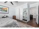 Modern bedroom featuring a ceiling fan, two closets, and warm wooden floors at 3279 E Selma Hwy, Casa Grande, AZ 85194