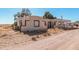 Exterior view of the home showcasing its architectural style, lot, and surroundings at 3279 E Selma Hwy, Casa Grande, AZ 85194