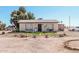 Exterior view of the home with a yard and ample parking at 3279 E Selma Hwy, Casa Grande, AZ 85194