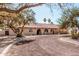 Charming single-story home featuring a tile roof, arched entryways, and well-maintained landscaping at 3279 E Selma Hwy, Casa Grande, AZ 85194