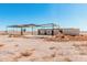 Rustic building featuring an open structure and block construction in a rural setting at 3279 E Selma Hwy, Casa Grande, AZ 85194