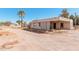 Exterior view showcases home with covered parking and desert landscaping, set against a clear sky at 3279 E Selma Hwy, Casa Grande, AZ 85194