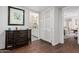 Hallway leading to bathroom with ample linen storage and stylish decor at 3279 E Selma Hwy, Casa Grande, AZ 85194