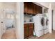 Functional laundry room with cabinetry, a utility sink, and a washer and dryer at 3279 E Selma Hwy, Casa Grande, AZ 85194