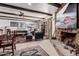 Inviting living room featuring wood beam ceiling, stone fireplace, and stylish furnishings at 3279 E Selma Hwy, Casa Grande, AZ 85194