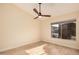 Bedroom with wood floors, light walls, and a large window at 3354 N 157Th Ave, Goodyear, AZ 85395