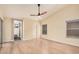 This bedroom features wood flooring, neutral walls, a window, and a ceiling fan at 3354 N 157Th Ave, Goodyear, AZ 85395