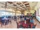 Elegant dining area with stylish chandeliers, comfortable seating, and large windows offering scenic views at 3354 N 157Th Ave, Goodyear, AZ 85395