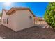 Back view of single-story home, showing back patio and landscaped yard at 3354 N 157Th Ave, Goodyear, AZ 85395