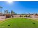 Scenic view of a meticulously maintained golf course under a bright sky at 3354 N 157Th Ave, Goodyear, AZ 85395