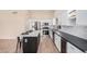 Modern kitchen featuring white cabinets, stainless steel appliances, and a center island at 3354 N 157Th Ave, Goodyear, AZ 85395