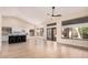 Bright living room showing eat-in kitchen with hardwood floors and access to a fenced backyard at 3354 N 157Th Ave, Goodyear, AZ 85395