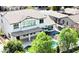 An aerial view of a home's backyard with a pool, covered patio, table with umbrella, and artificial grass at 3416 E Blue Ridge Pl, Chandler, AZ 85249