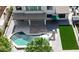 Overhead shot of a pool and patio area featuring artificial grass, outdoor dining, and a covered seating area at 3416 E Blue Ridge Pl, Chandler, AZ 85249