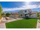 Expansive backyard featuring a pristine pool, a slide, manicured artificial turf, and an outdoor dining area at 3416 E Blue Ridge Pl, Chandler, AZ 85249