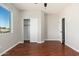 Bedroom with wood floors, closet, and access door at 3416 E Blue Ridge Pl, Chandler, AZ 85249