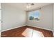 Empty bedroom featuring hardwood floors, a ceiling fan, and a window at 3416 E Blue Ridge Pl, Chandler, AZ 85249