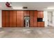 Spacious garage featuring custom built-in wooden cabinets for ample storage space at 3416 E Blue Ridge Pl, Chandler, AZ 85249