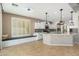 Bright kitchen with stainless steel appliances, white cabinetry and a cozy breakfast nook by the window at 3416 E Blue Ridge Pl, Chandler, AZ 85249