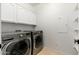 Laundry room with side by side washer and dryer and cabinets for storage at 3416 E Blue Ridge Pl, Chandler, AZ 85249