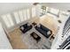 Bright living room with modern furniture, plantation shutters, and tile flooring at 3416 E Blue Ridge Pl, Chandler, AZ 85249