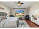 Bright main bedroom showcasing a large window, modern furniture, and neutral decor at 3416 E Blue Ridge Pl, Chandler, AZ 85249