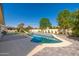 Outdoor pool with a water slide, landscaping, and privacy walls at 3416 E Blue Ridge Pl, Chandler, AZ 85249