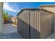 A metal storage shed located in the backyard, providing ample space for storing tools and outdoor equipment at 3416 E Blue Ridge Pl, Chandler, AZ 85249