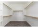 Empty walk-in closet with carpet and wooden shelving at 3416 E Blue Ridge Pl, Chandler, AZ 85249