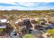 Aerial view of the property featuring a Southwestern style condo surrounded by desert landscape at 36601 N Mule Train Rd # D30, Carefree, AZ 85377