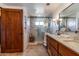 Modern bathroom featuring a glass-enclosed shower, double vanity, and stylish finishes for a spa-like experience at 36601 N Mule Train Rd # D30, Carefree, AZ 85377