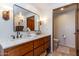 Stylish bathroom featuring double sinks, wooden vanity, and modern fixtures for a luxurious experience at 36601 N Mule Train Rd # D30, Carefree, AZ 85377