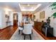 Dining area with hardwood floors conveniently flows into the living room and kitchen at 36601 N Mule Train Rd # D30, Carefree, AZ 85377