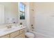 Well-lit bathroom with a large vanity, tile backsplash, and a combined shower and tub at 37080 N 109Th Way, Scottsdale, AZ 85262