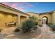 Inviting courtyard featuring desert landscaping and outdoor dining area, perfect for enjoying warm evenings at 37080 N 109Th Way, Scottsdale, AZ 85262