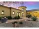 Elegant front entrance with a charming turret and desert landscaping at 37080 N 109Th Way, Scottsdale, AZ 85262