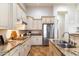 Spacious kitchen featuring granite counters, modern appliances, and ample cabinet space at 37080 N 109Th Way, Scottsdale, AZ 85262