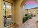 Open entryway to the living room with neutral paint and a stone walkway to the front yard at 37080 N 109Th Way, Scottsdale, AZ 85262