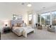 Spacious main bedroom with carpet flooring, recessed lighting, and plentiful natural light from large windows at 37080 N 109Th Way, Scottsdale, AZ 85262