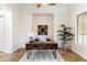 Office with a modern wooden desk, white walls, and a large window providing natural light at 37080 N 109Th Way, Scottsdale, AZ 85262